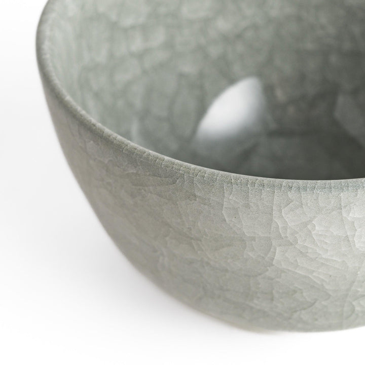 Azure clay matcha bowl with a smooth cracked texture, offering a calming, elegant design for an enjoyable tea experience.