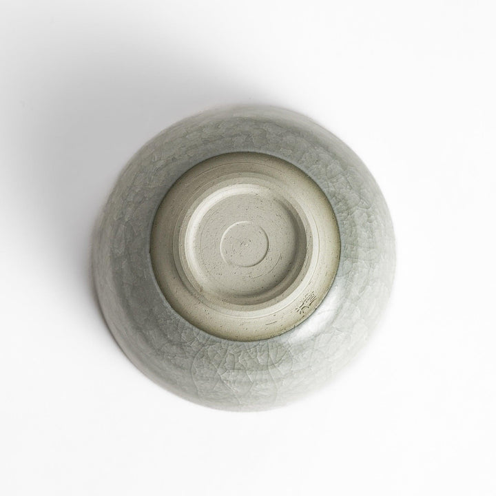 Azure clay matcha bowl with a smooth cracked texture, offering a calming, elegant design for an enjoyable tea experience.