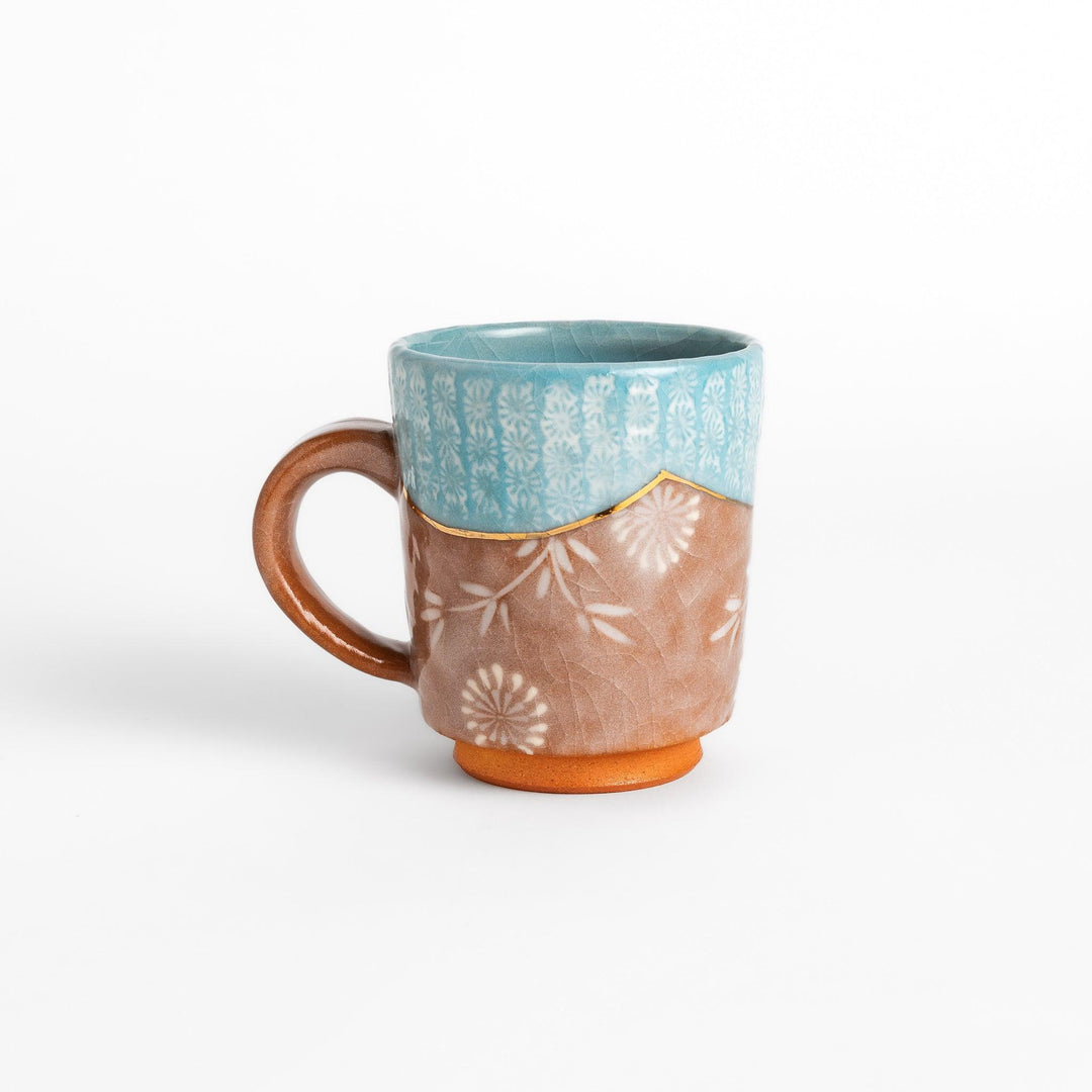 Blue floral mug with gold rim and delicate pattern, perfect for adding charm to your daily tea time.