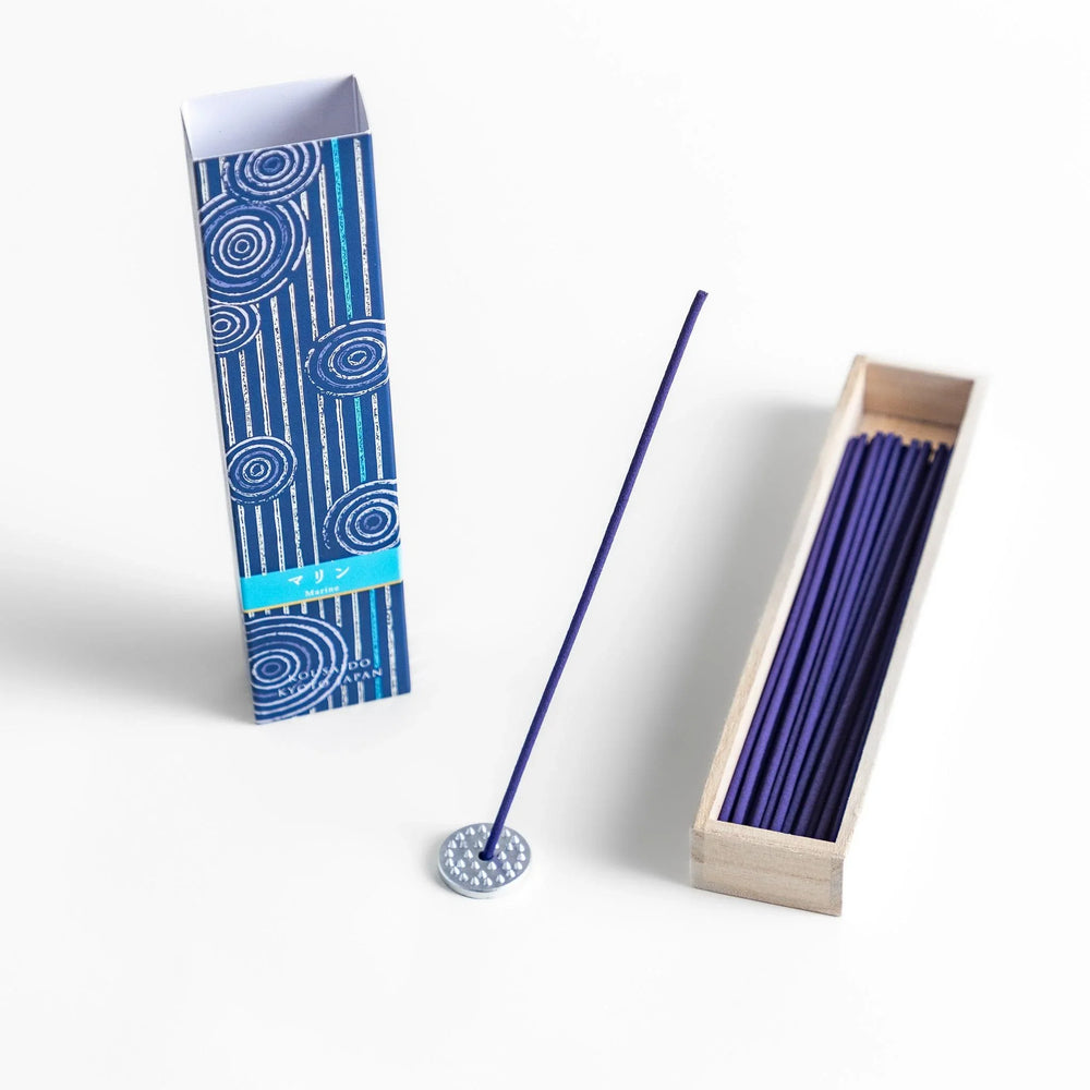 Japanese marine incense sticks in a wooden box with a deep blue patterned sleeve inspired by the ocean, made in Kyoto