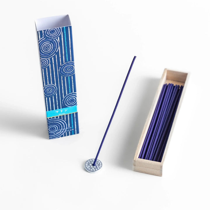 Japanese marine incense sticks in a wooden box with a deep blue patterned sleeve inspired by the ocean, made in Kyoto