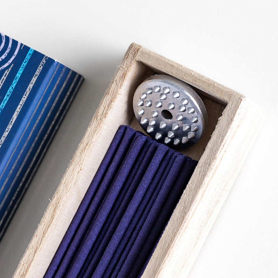 Japanese marine incense sticks in a wooden box with a deep blue patterned sleeve inspired by the ocean, made in Kyoto