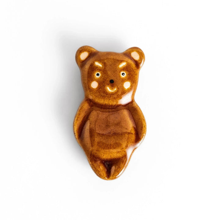 Bear-shaped chopstick rest, featuring a cute smiling face and playful design.