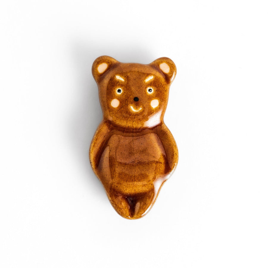 Bear-shaped chopstick rest, featuring a cute smiling face and playful design.