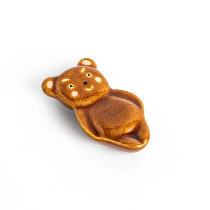 Bear-shaped chopstick rest, featuring a cute smiling face and playful design.