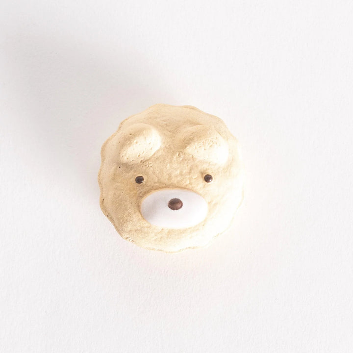 A top-down view of the bear cupcake ceramic chopstick rest, showcasing its circular shape and intricate details.