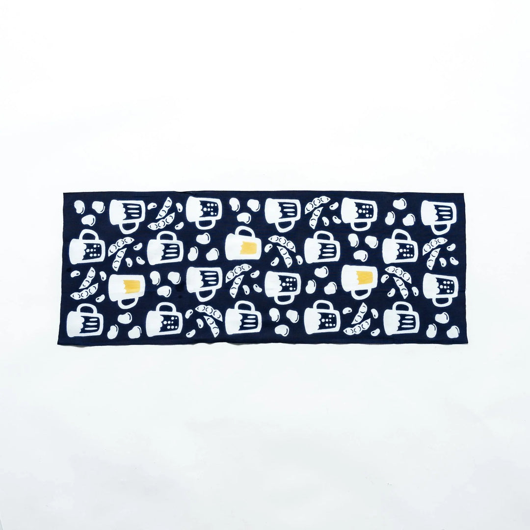 Fully extended dark navy tenugui showcasing beer mugs, soybeans, and edamame patterns in white and yellow.