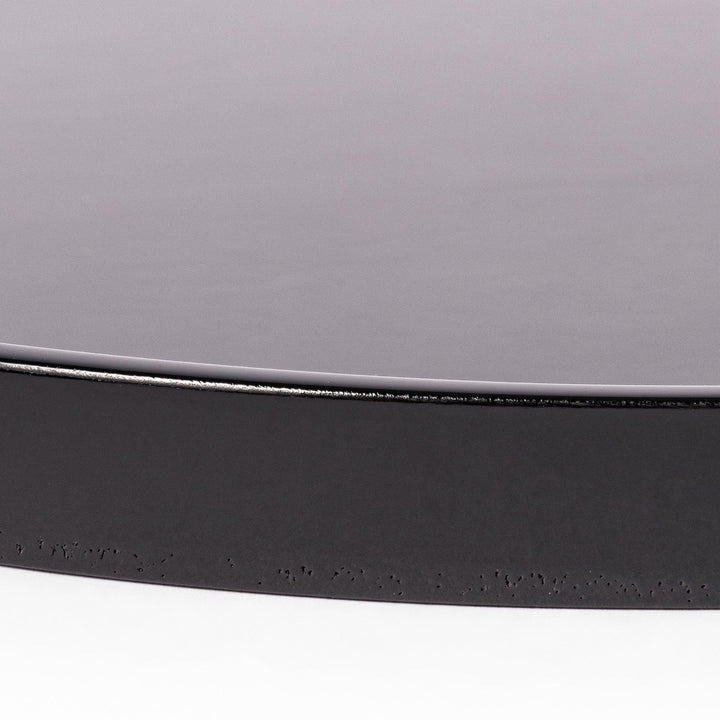 Glossy black Japanese wooden round tray with raised rim for serving tea or displaying tableware elegantly.
