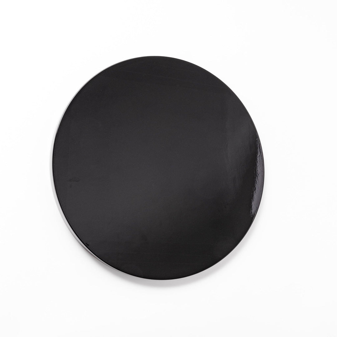 Glossy black Japanese wooden round tray with raised rim for serving tea or displaying tableware elegantly.