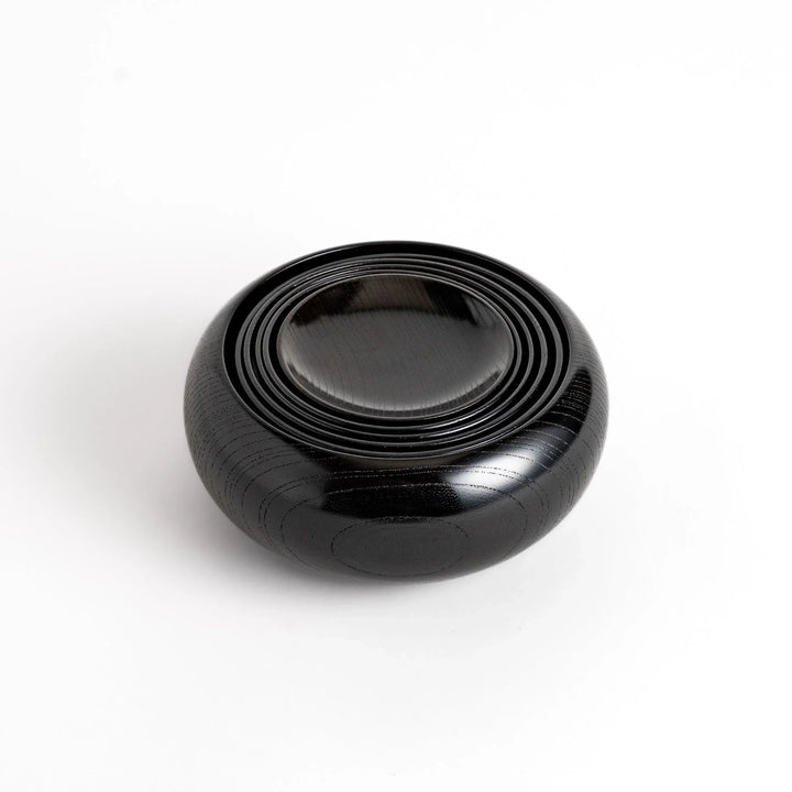 Black lacquer Oryoki bowl set with large serving bowl three medium bowls and small plates glossy finish.