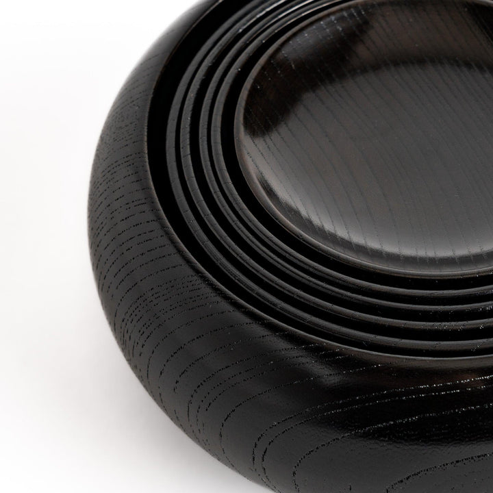 Black lacquer Oryoki bowl set with large serving bowl three medium bowls and small plates glossy finish.