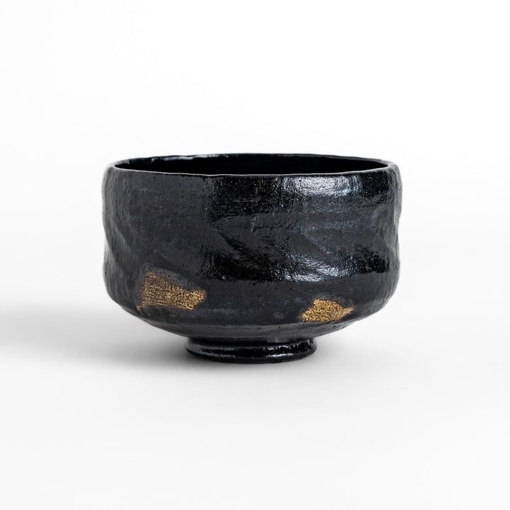 Turquoise crackle-glazed teapot with floral patterns and gold-accented spout, blending elegance and craftsmanship.