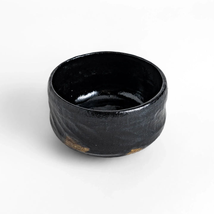 Turquoise crackle-glazed teapot with floral patterns and gold-accented spout, blending elegance and craftsmanship.