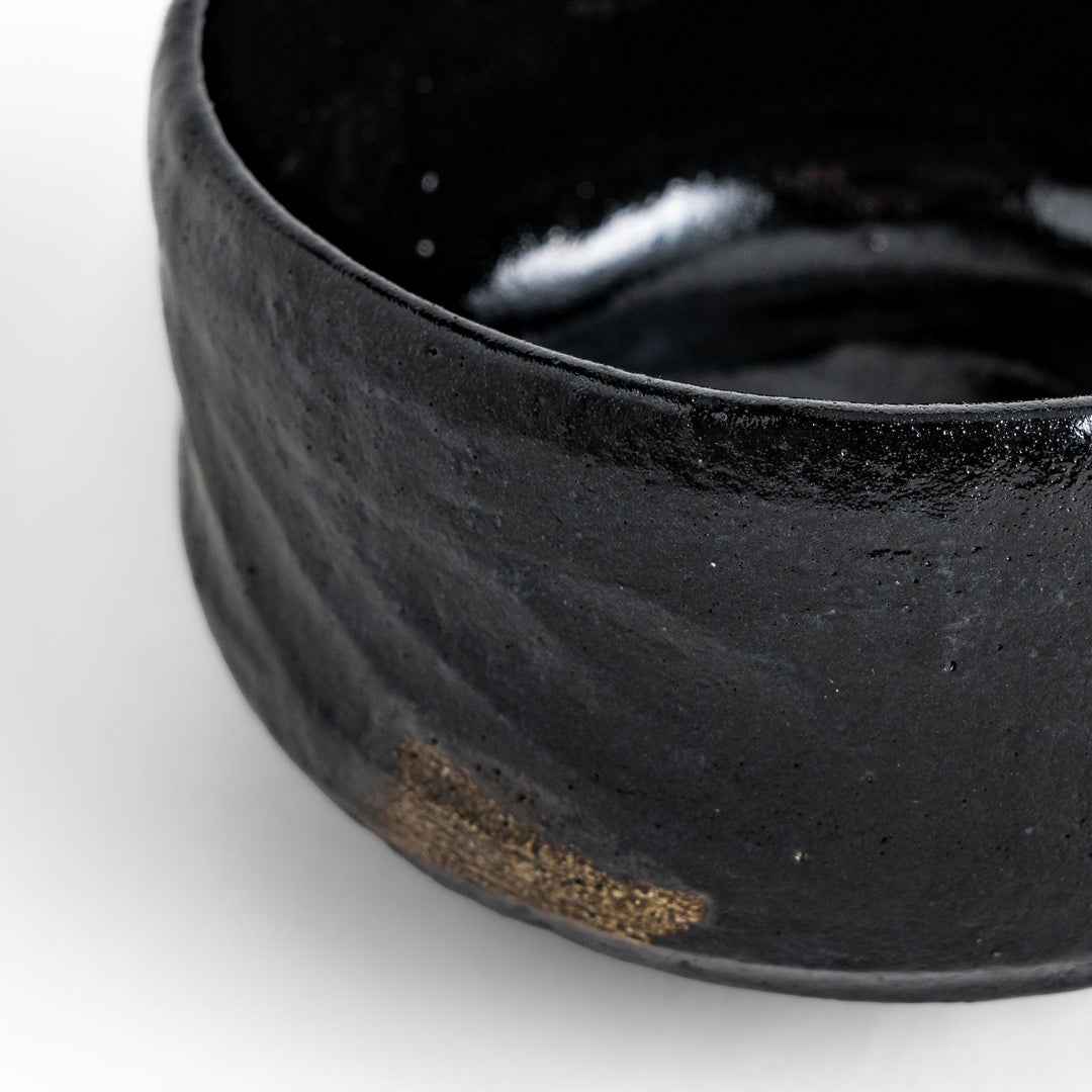 Turquoise crackle-glazed teapot with floral patterns and gold-accented spout, blending elegance and craftsmanship.