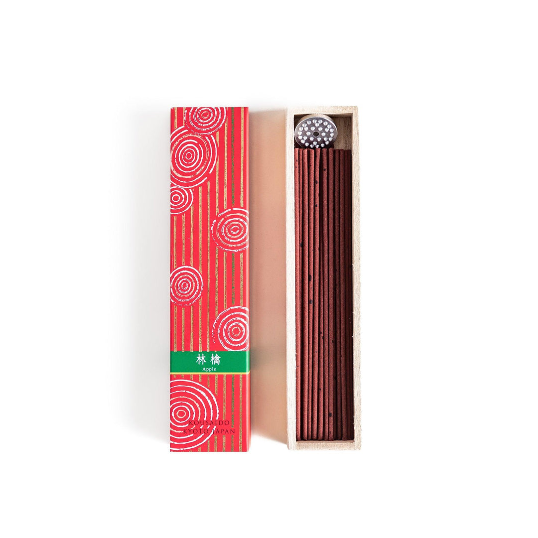 Japanese Apple incense sticks in a vivid red patterned box with wooden holder, offering a crisp and fruity aroma from Kyoto