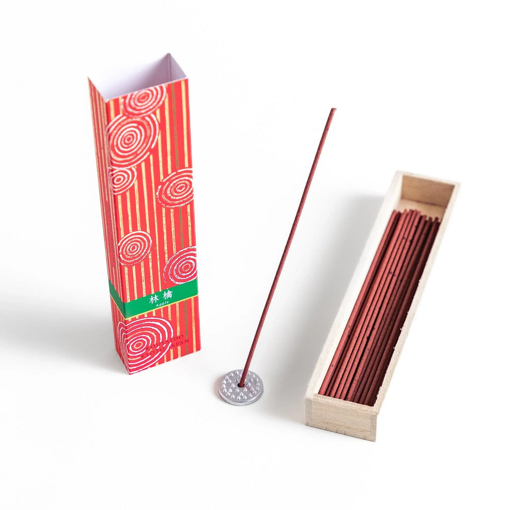 Japanese Apple incense sticks in a vivid red patterned box with wooden holder, offering a crisp and fruity aroma from Kyoto