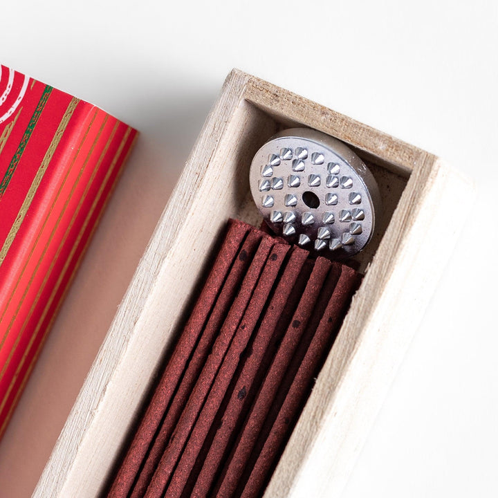 Japanese Apple incense sticks in a vivid red patterned box with wooden holder, offering a crisp and fruity aroma from Kyoto