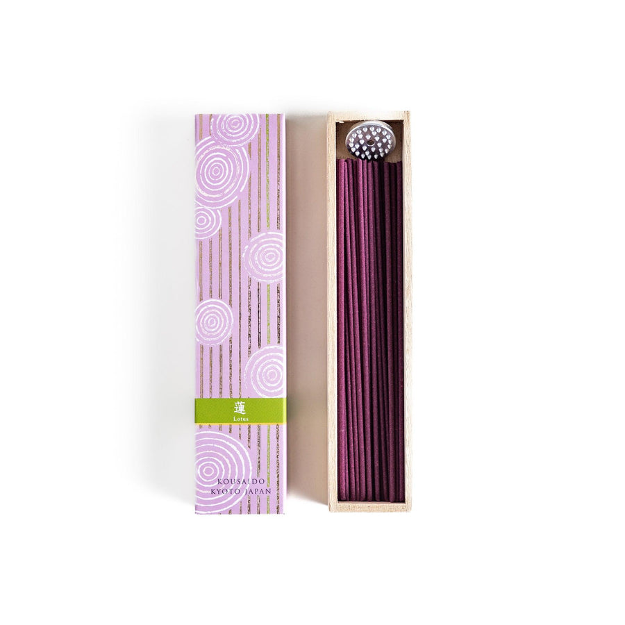 Japanese lavender incense in wooden box with purple sticks and white circle pattern on soft packaging.