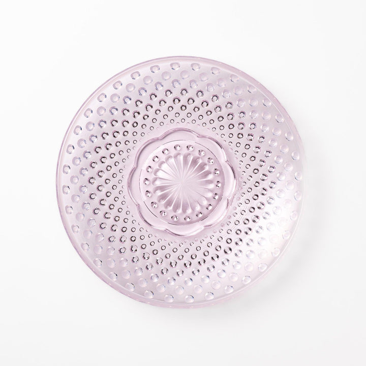Pink glass dessert bowl and saucer with raised dot texture and starburst base, perfect for elegant sweets or fruit servings.
