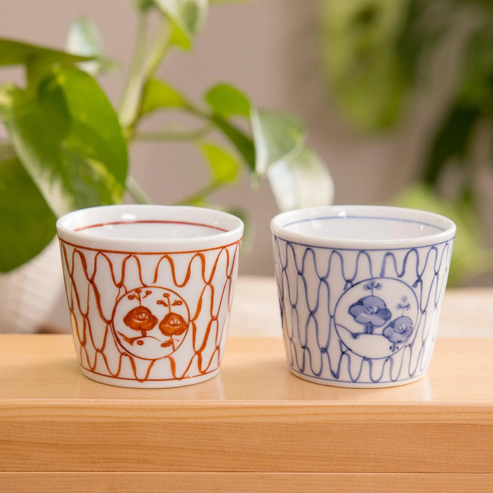 Charming small bowls in red and blue with a delicate blossom mesh design. Perfect for condiments or snacks, adding elegance.