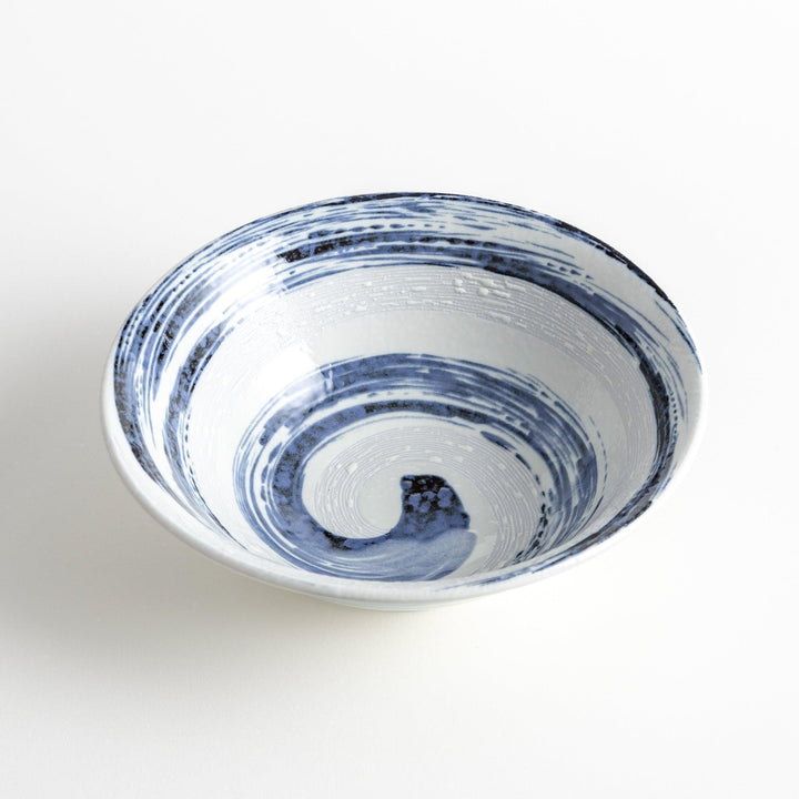 A large white bowl with a blue swirl pattern on the interior, featuring a smooth finish.