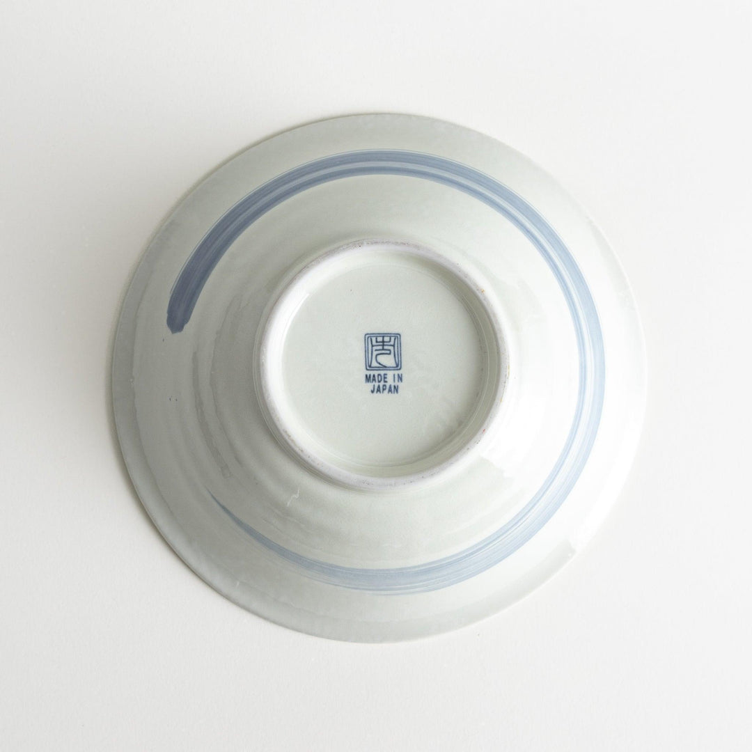 A large white bowl with a blue swirl pattern on the interior, featuring a smooth finish.