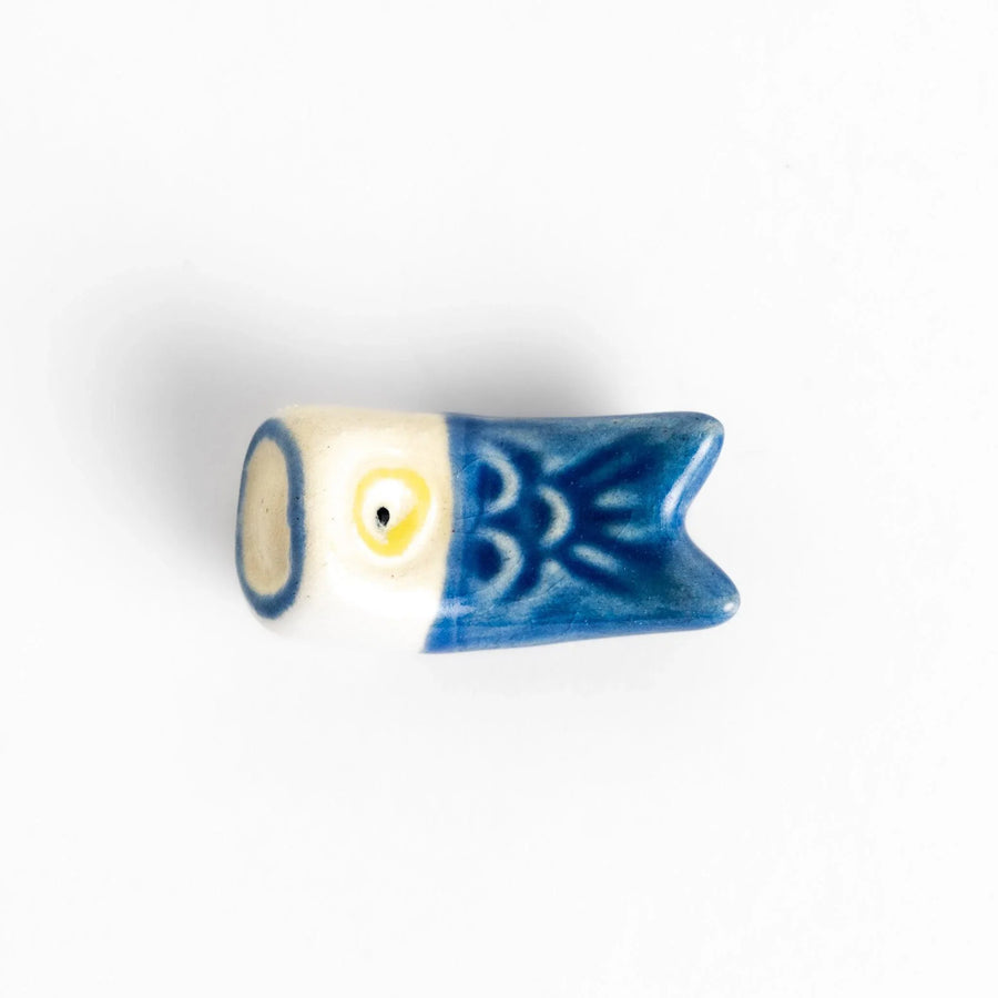 Blue carp streamer chopstick rest with hand-painted details, celebrating a traditional Japanese festive design.