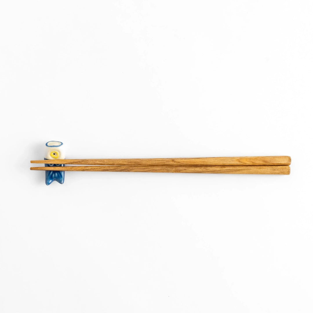 Blue carp streamer chopstick rest with hand-painted details, celebrating a traditional Japanese festive design.