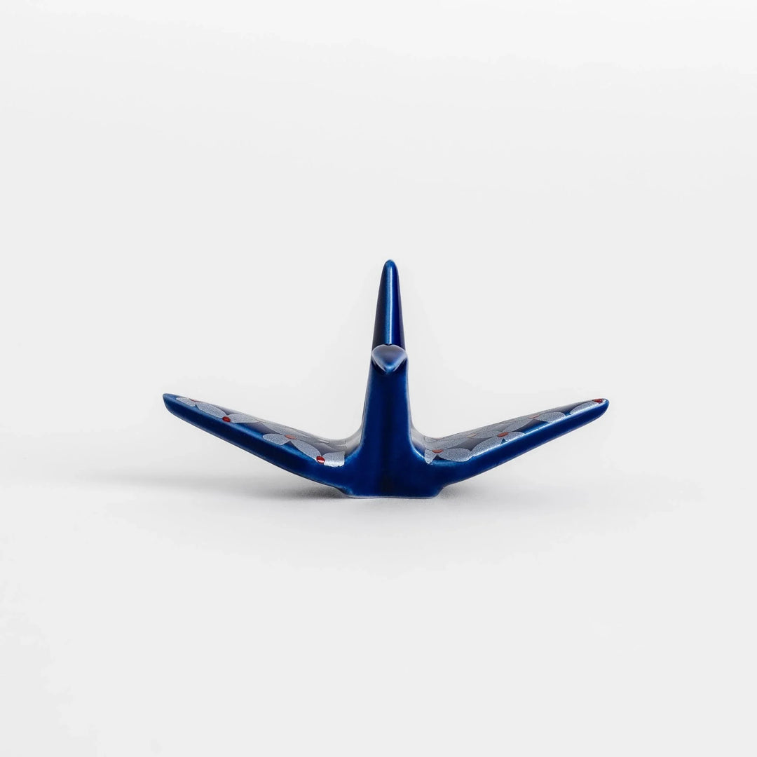 Blue origami crane incense holder with a geometric silver and red pattern, adding a unique, artistic touch to your space.