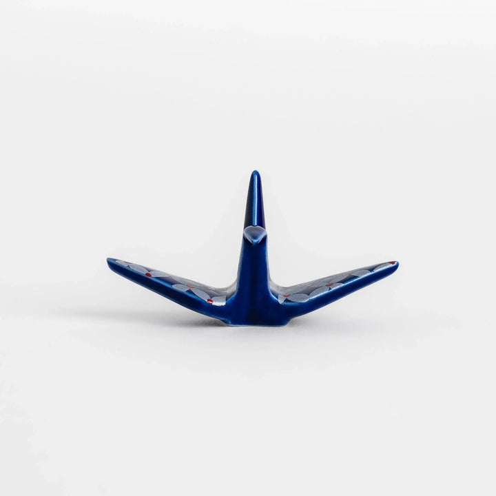 Blue origami crane incense holder with a geometric silver and red pattern, adding a unique, artistic touch to your space.