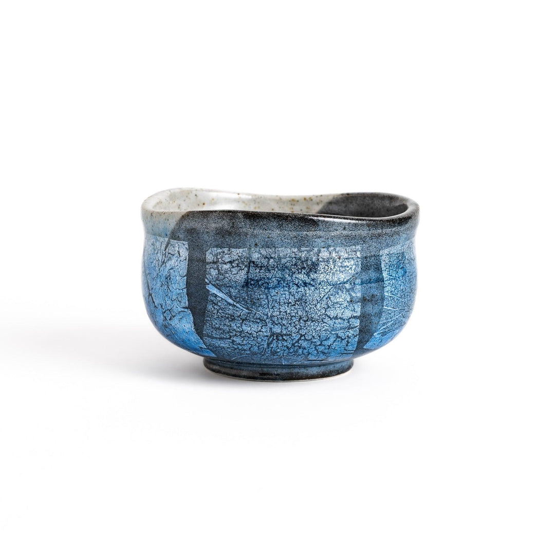 Blue matcha bowl with reactive crackle glaze perfect for whisking and savoring traditional Japanese tea.