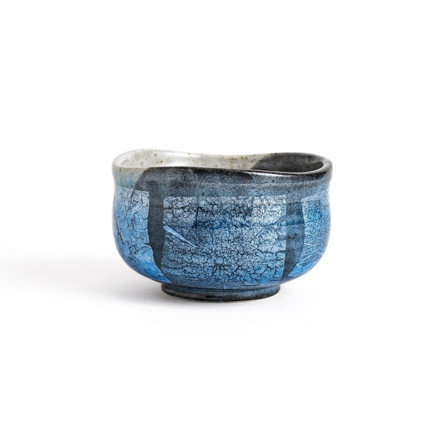 Blue matcha bowl with reactive crackle glaze perfect for whisking and savoring traditional Japanese tea.