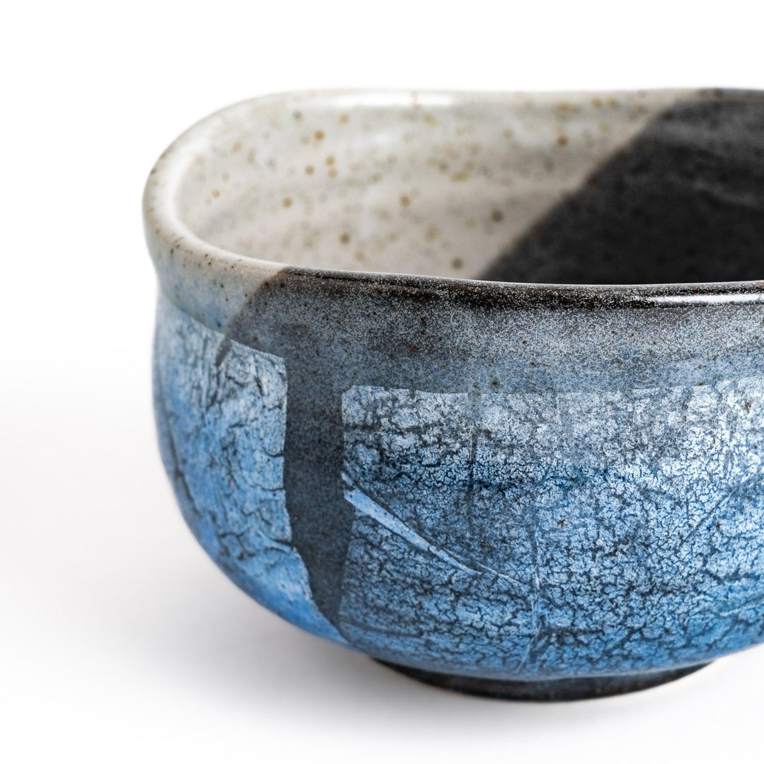 Blue matcha bowl with reactive crackle glaze perfect for whisking and savoring traditional Japanese tea.