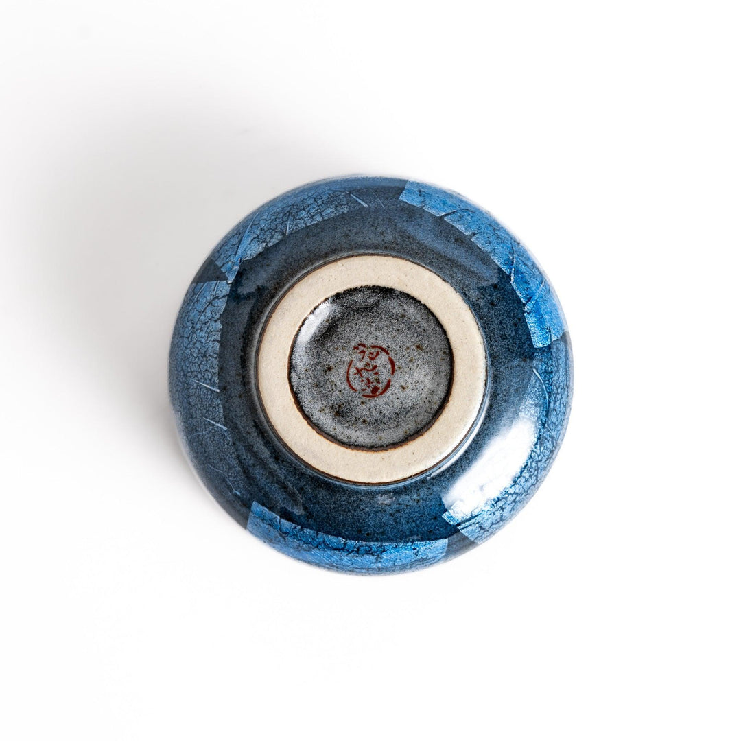 Blue matcha bowl with reactive crackle glaze perfect for whisking and savoring traditional Japanese tea.
