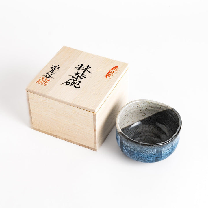 Blue matcha bowl with reactive crackle glaze perfect for whisking and savoring traditional Japanese tea.