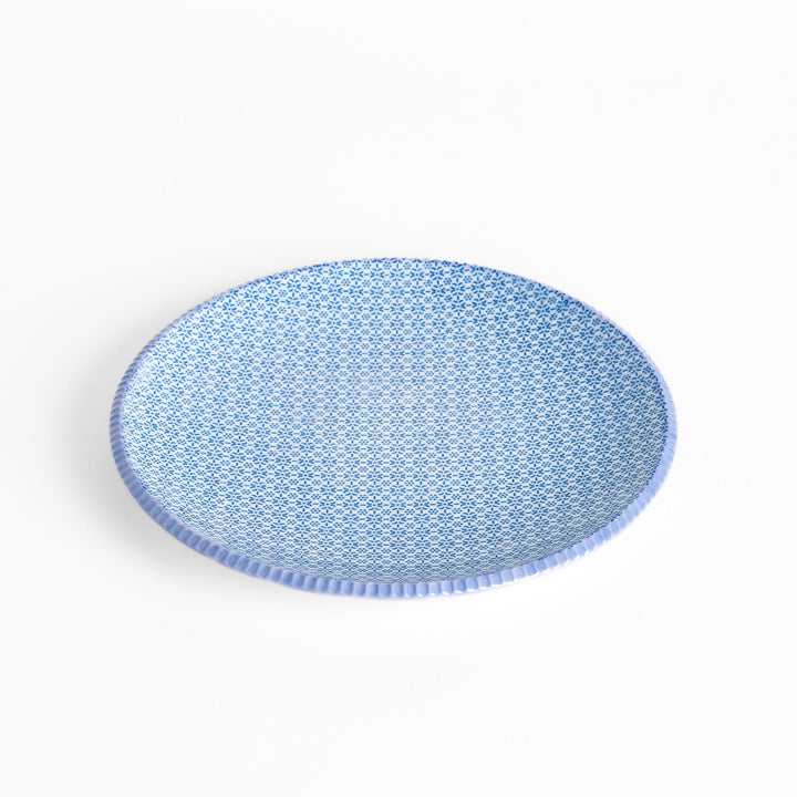 Blue and white floral patterned Japanese dinner plate with subtle striped rim for refined dining style.