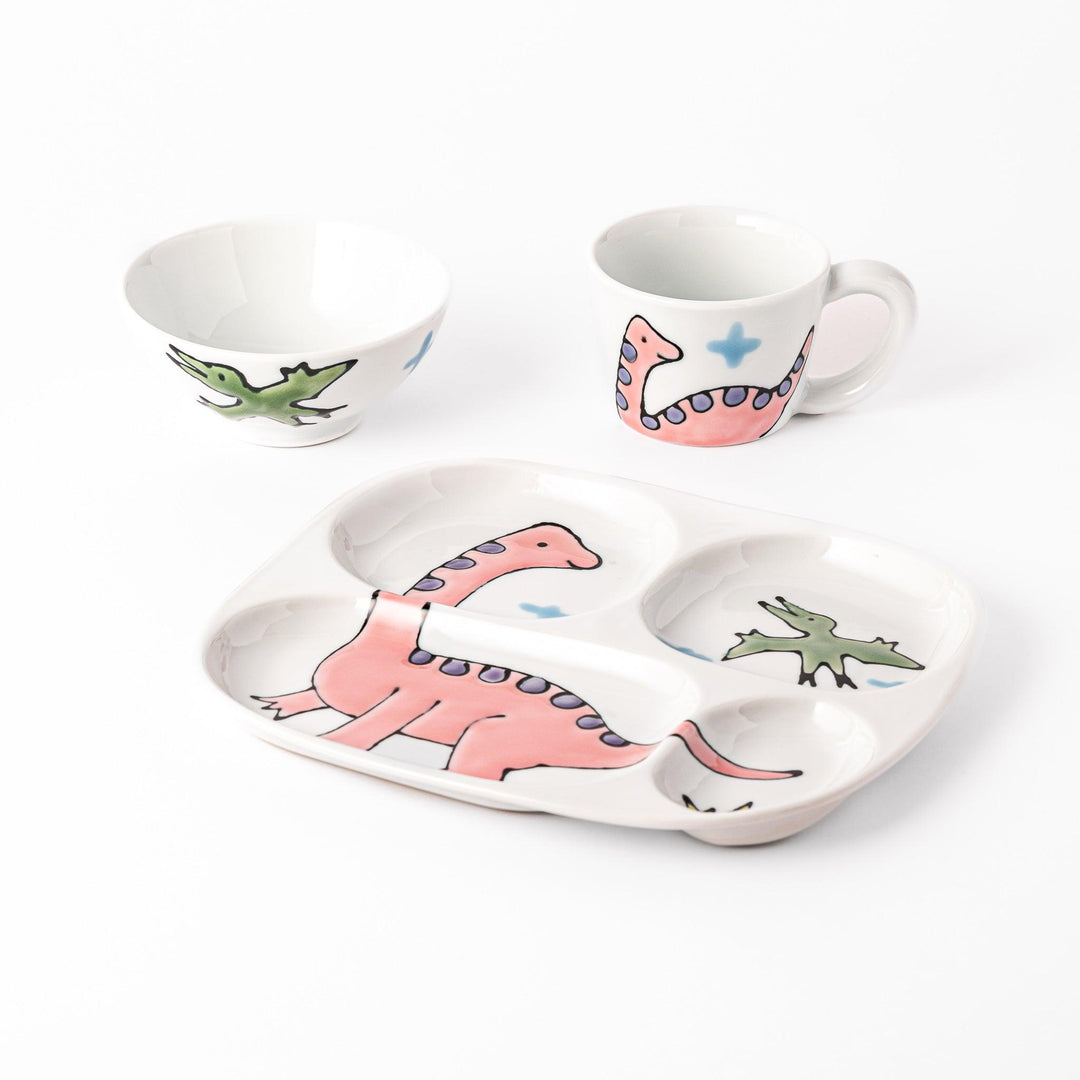 Kids dinosaur dining set with plate bowl and cup featuring pink Brachiosaurus and green flying dinosaur.