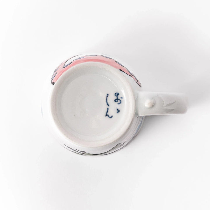 Kids' mug with a playful pink Brachiosaurus design, featuring purple spots and blue accents, perfect for adding a fun touch to your child's mealtime.