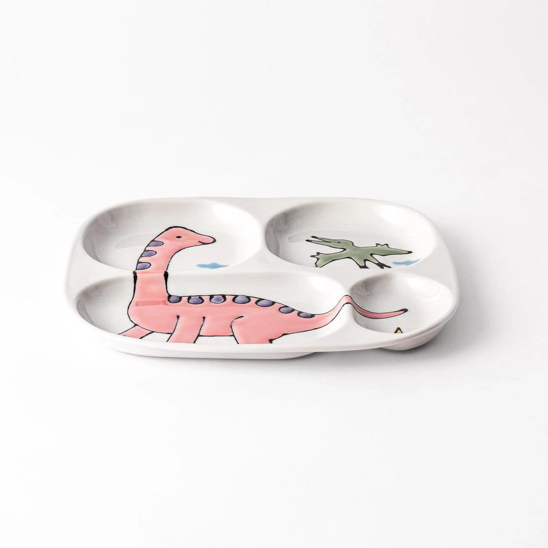 Japanese ceramic kids dinnerware set with pink dinosaur and green pterodactyl design including plate bowl and mug.
