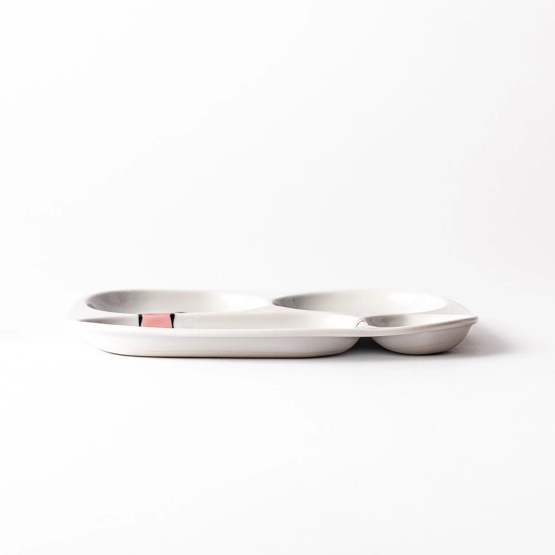 Japanese ceramic kids dinnerware set with pink dinosaur and green pterodactyl design including plate bowl and mug.