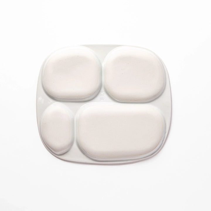 Japanese ceramic kids dinnerware set with pink dinosaur and green pterodactyl design including plate bowl and mug.