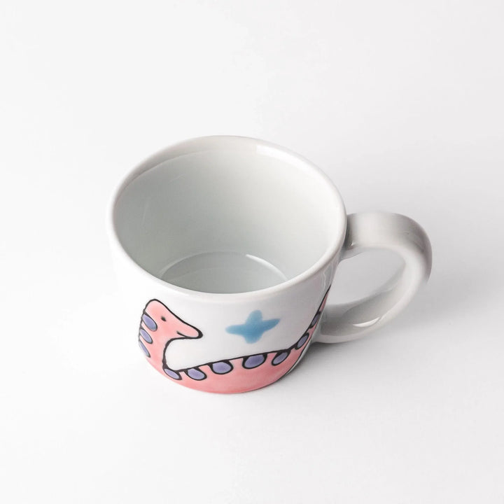 Kids’ mug with pink Brachiosaurus and purple spots, adding a playful touch to children’s mealtime.