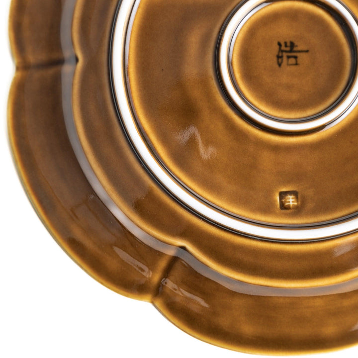Earthy tones of olive, caramel, or off-white salad plate, with a soft, rounded shape and subtle color variations.
