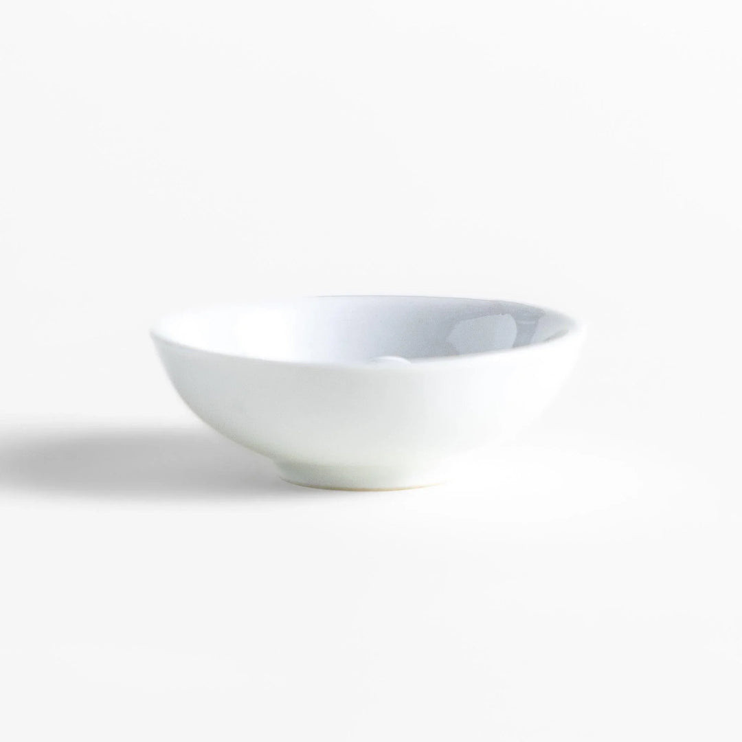 Japanese ceramic bunny incense holder set with small white dish and cute pink and green rabbit charm design.