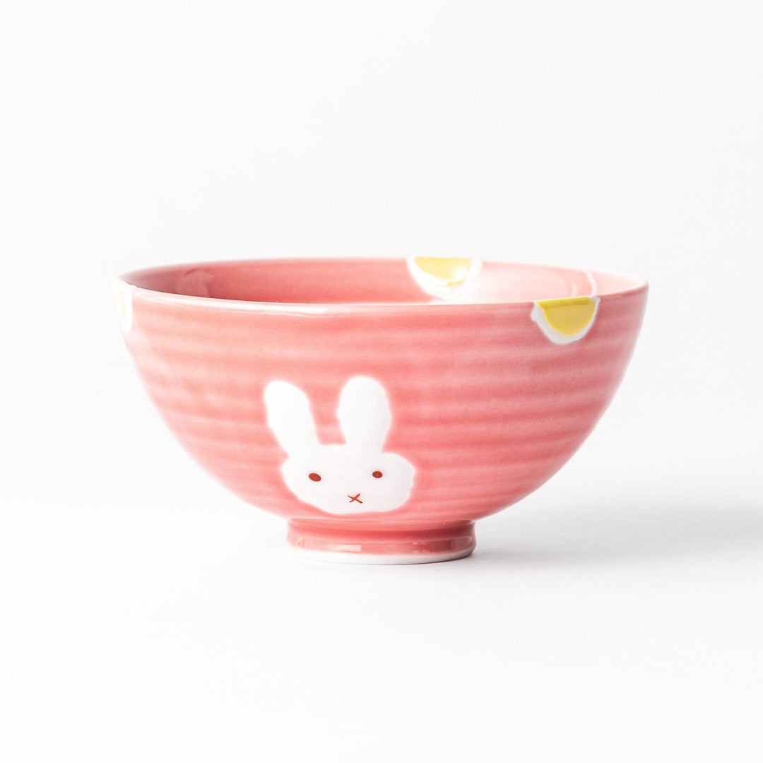 Charming pink kids' rice bowl featuring a cute bunny illustration and yellow accents, perfect for adding a playful touch to mealtime.
