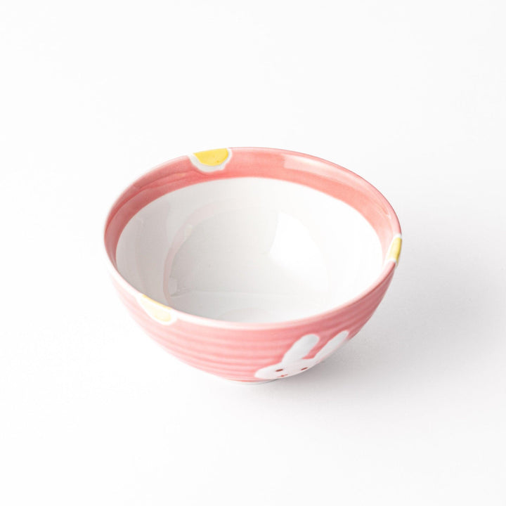 Charming pink kids' rice bowl featuring a cute bunny illustration and yellow accents, perfect for adding a playful touch to mealtime.