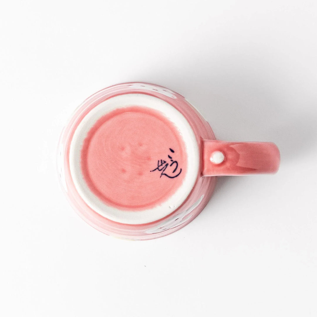 Pink kids’ mug with bunny design and yellow accents, adding a bright, fun touch to children’s tableware.