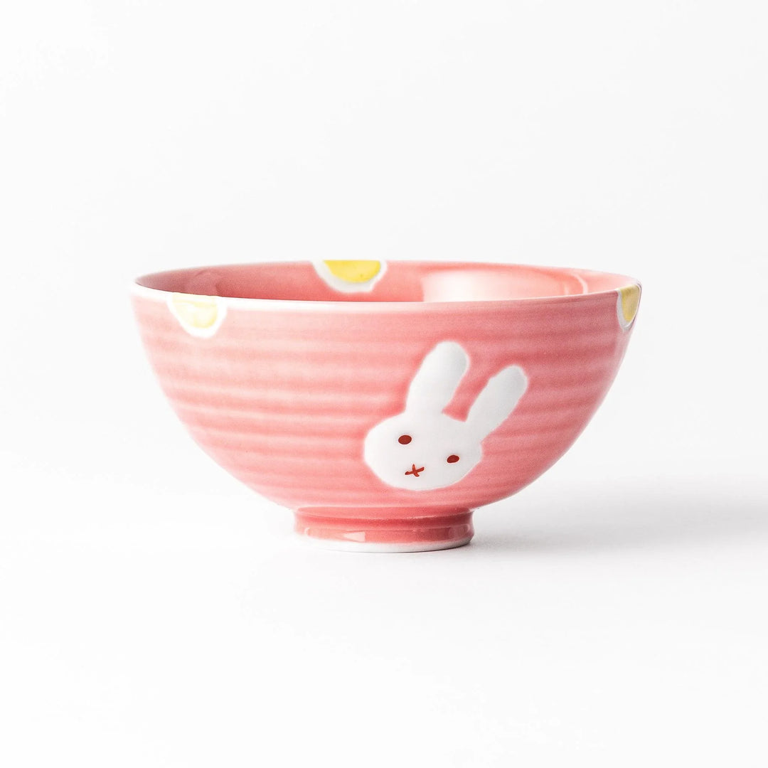 Pink kids’ rice bowl with cute bunny illustration and yellow accents, ideal for playful mealtime moments.
