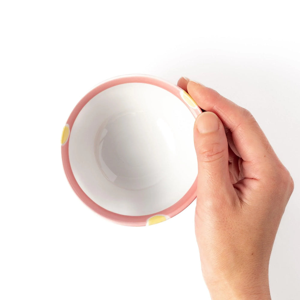 Pink kids’ rice bowl with cute bunny illustration and yellow accents, ideal for playful mealtime moments.