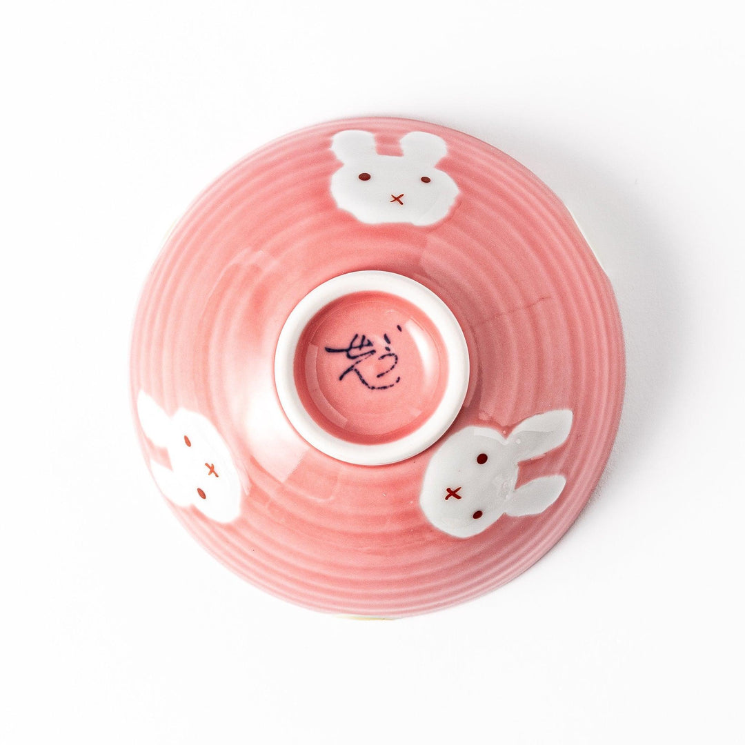 Pink kids’ rice bowl with cute bunny illustration and yellow accents, ideal for playful mealtime moments.